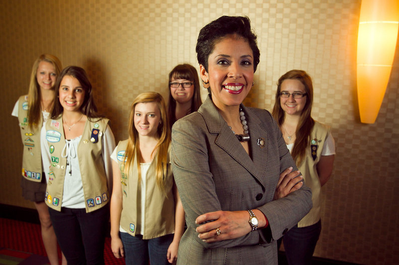 Anna Maria Chavez, Girl Scouts CEO, stands with scouts from Phoenix, Ariz. “Our world is becoming smaller,” she said, “and our young people need ... to engage with peers.”
