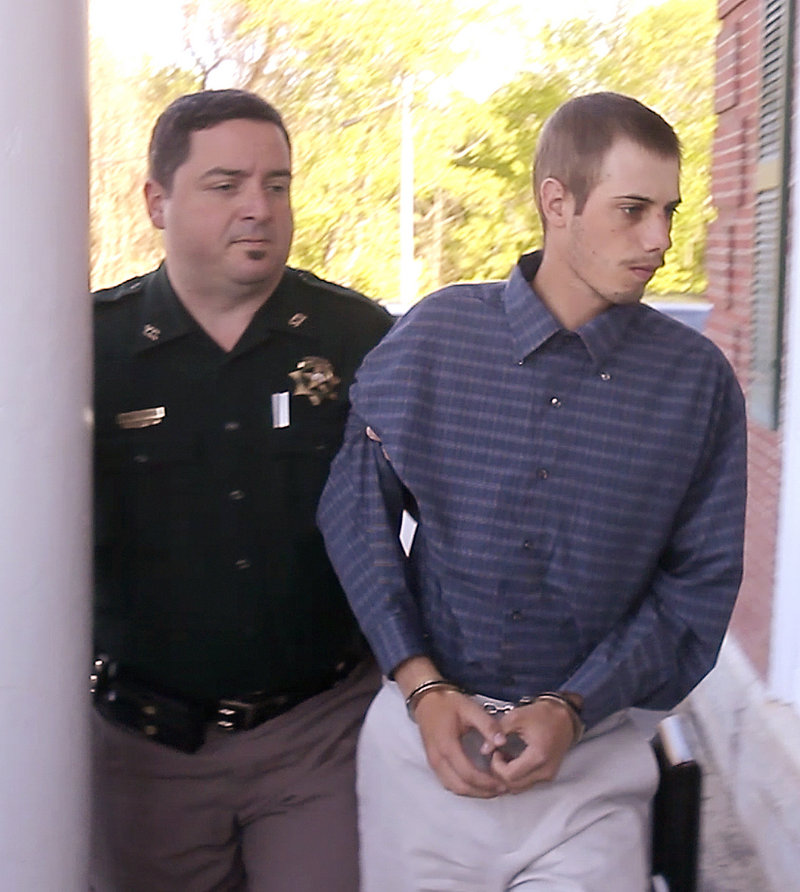 Gordon Collins-Faunce is led into York County Superior Court in Alfred on Friday. Collins-Faunce was charged with depraved indifference murder in the death of his infant son and is being held at the York County Jail in lieu of $100,000 bail.