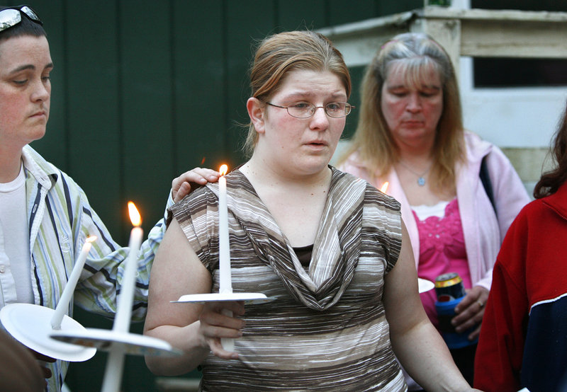 Christina Henderson, mother of 10-week-old Ethan, who died Tuesday from brain injuries, speaks during a memorial vigil in Arundel on Saturday.