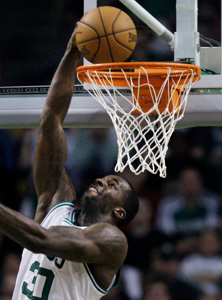 Brandon Bass of the Boston Celtics puts in a reverse layup Saturday night during Game 1 of the Eastern Conference semifinals against the Philadelphia 76ers. Boston won, 92-91.