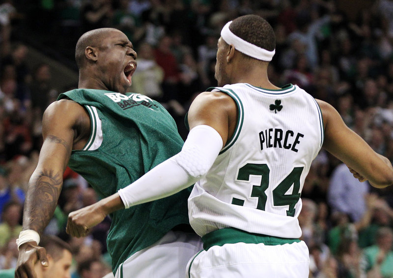 Paul Pierce, right, rejoices with Mickael Pietrus late in Saturday night’s win over the 76ers in the opener of their Eastern semifinal series.