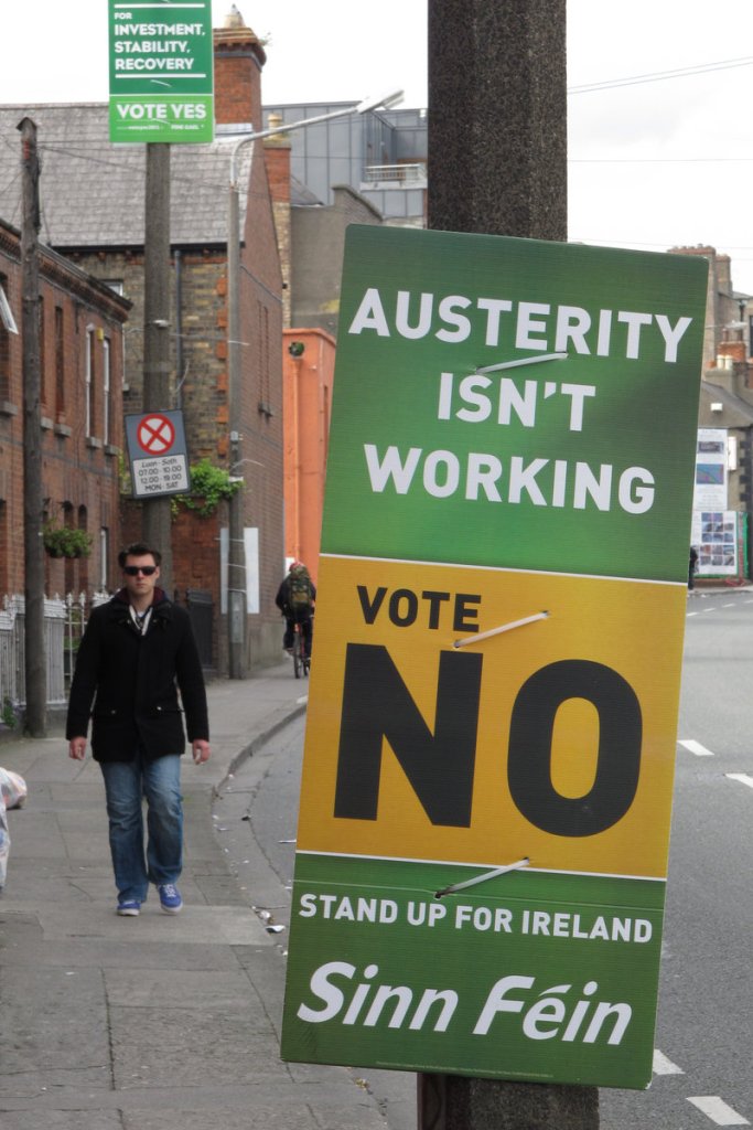 A man walking down a street in Dublin on Sunday passes rival referendum posters advising "yes" and "no" votes. Ireland's May 31 vote represents the only popular test of opinion for the European Union's deficit-fighting agreement. Ireland cannot ratify the treaty without majority "yes" support.