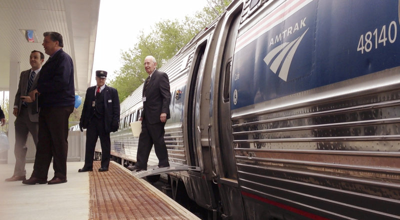Ed Bonney, chairman of the Freeport Train Committee, steps off the Downeaster at the station in Freeport on Monday.