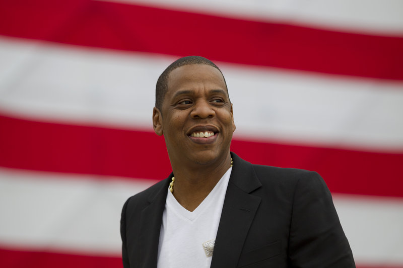 Entertainer Shawn "Jay-Z" Carter smiles in between interviews, after a news conference at the Philadelphia Museum of Art on Monday.