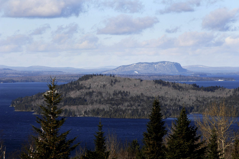 Mount Kineo rises near Moosehead Lake. The conservation easement covering 363,000 acres in the region is one of the largest in U.S. history, according to participants in the deal. They also hope the agreement will boost recreational tourism and improve the area’s struggling economy.