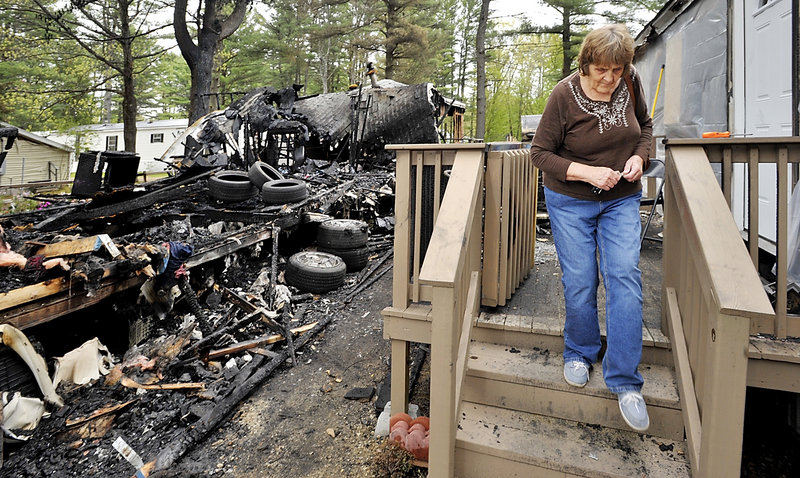 Pamela Caccialini walks down the steps to her partially-damaged mobile home. She said she believes there would have been less damage to her home if the radio jamming had not happened. “I hope they catch the person, that’s all,” she said.