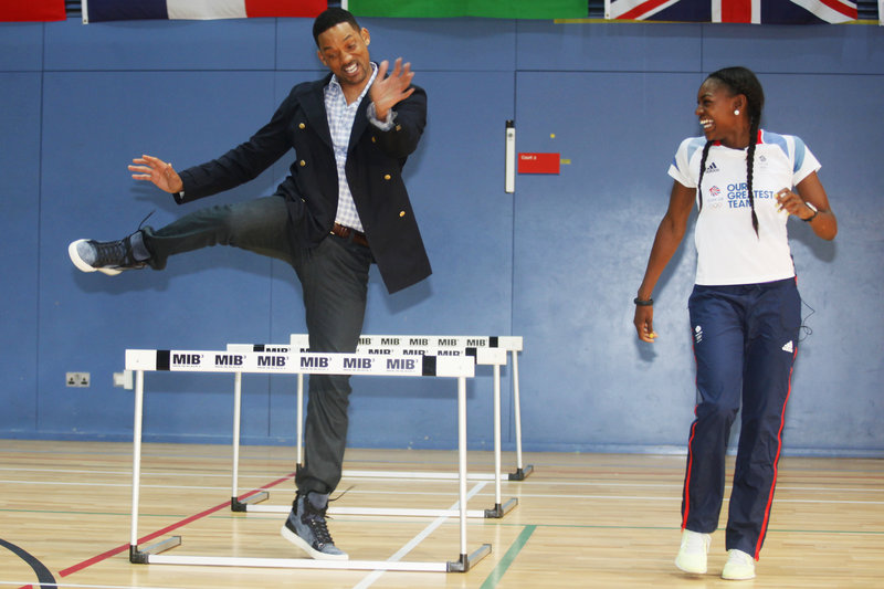 Actor Will Smith tries the hurdles with Great Britain’s 400-meter Olympic hurdler Perri Shakes-Drayton at Ethos gym in London on Wednesday. The Hollywood star took time out of his promotional schedule for “Men in Black III” to take a stab at some sports, before the U.K. premiere of the film later in the day. He praised the athleticism of those he met, confessing he has “never been really athletic.”