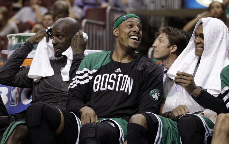 Paul Pierce, flanked by Kevin Garnett, left, and Rajon Rondo, had the chance to smile Wednesday night in the final moments of Boston’s 107-91 victory.