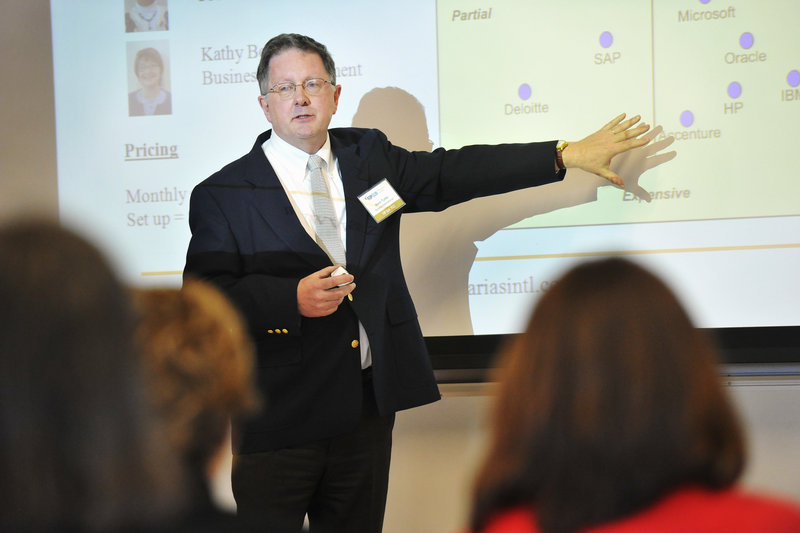 Mark Tuttle, owner of Azarias International, pitches his product to potential investors at USM. The presenters from the Maine Center for Entrepreneurial Development's Top Gun program had ideas for low-tech products such as custom shoe orthodics to high-tech items like software for architects.