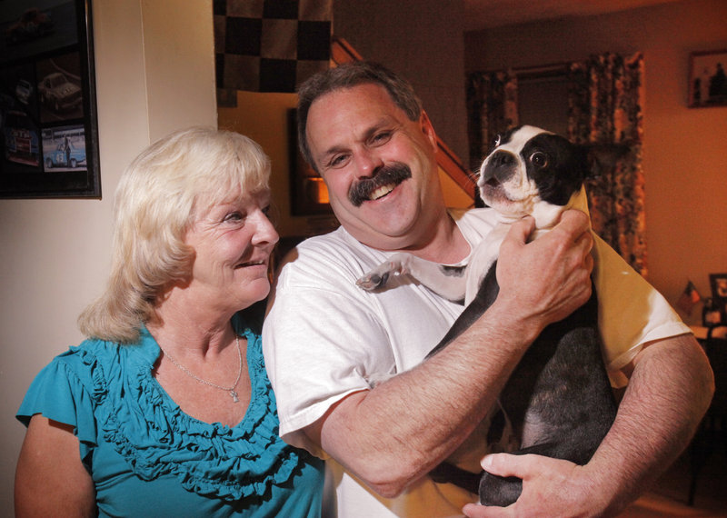Laureen Rugen, her boyfriend, Don Merrill, and their dog Gizmo pose for a photo at their home in Naples. Since Rugen’s graduation from trauma therapy, they are savoring her triumphs over fears and flashbacks from her years of abuse.
