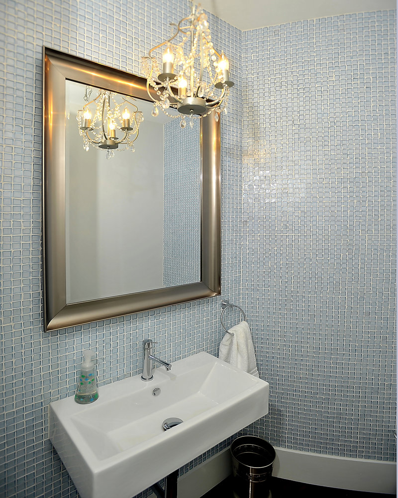 A chandelier brings bling to one of the bathrooms.