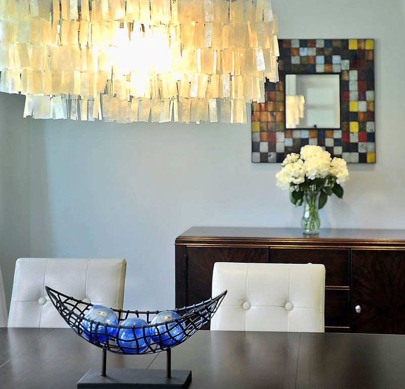 Another lighting choice adds dazzle to the decor of the contemporary-style formal dining room.