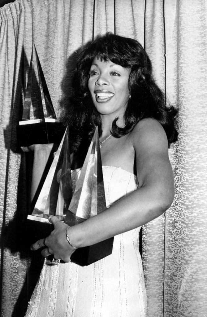 Summer poses with three awards she won at the American Music Awards in Los Angeles, Calif., on Jan. 12, 1979.