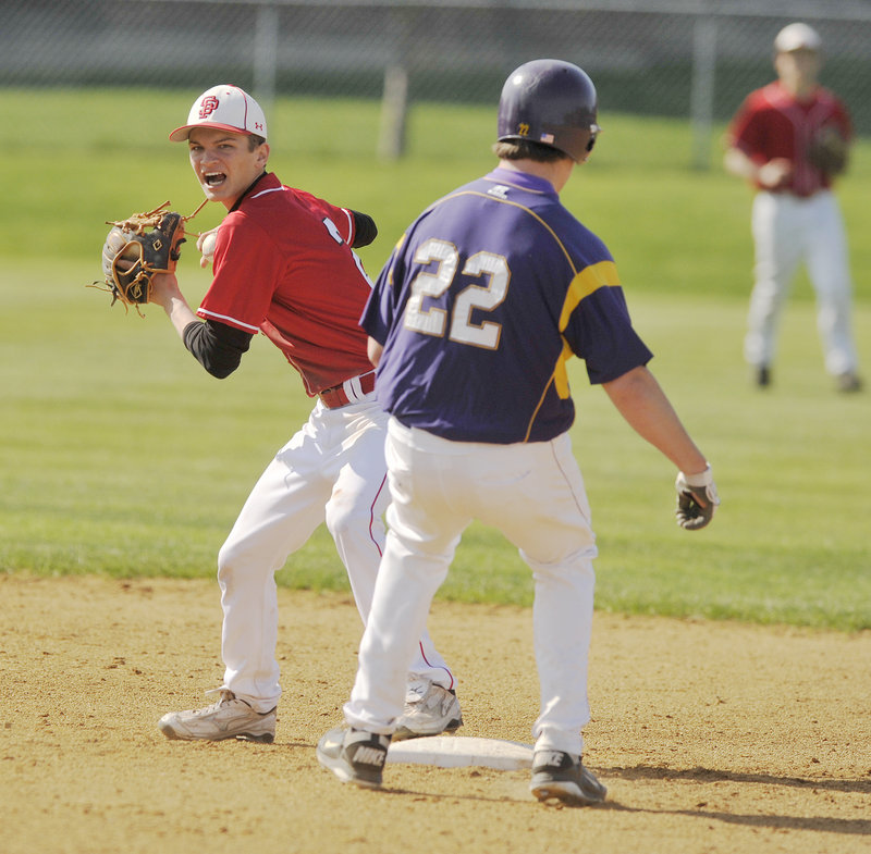 South Portland shortstop Dominic Desjardins tries to complete a double play after forcing out Ryan Casale during Cheverus' 9-4 victory Thursday.