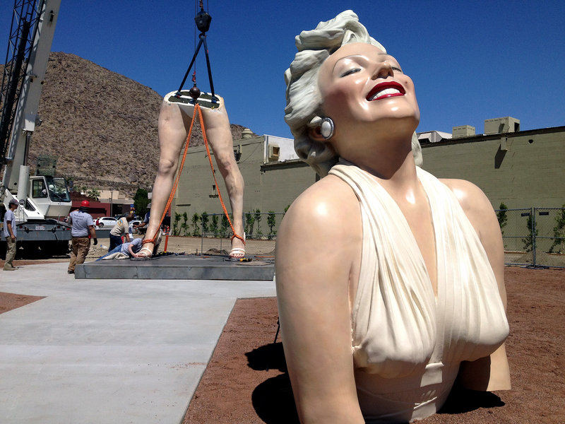 “Forever Marilyn” is reassembled Monday at the corner of Palm Canyon Drive and Tahquitz Canyon Way in Palm Springs, Calif.