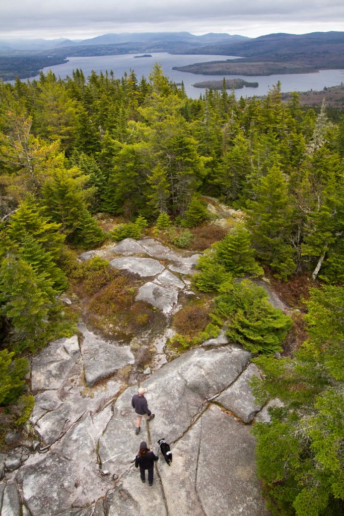 The payoff for hikers willing to endure the climb to the summit of Bald Mountain, humans and canines alike, is a breathtaking view of the Rangeley region.