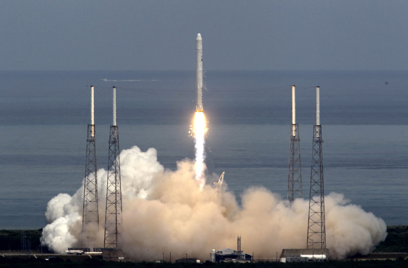 In photo from June 4, 2010, the SpaceX Falcon 9 test rocket lifts off from Cape Canaveral, Fla., carrying a mock-up of the private company’s Dragon spacecraft atop the rocket.