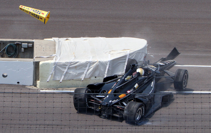 Oriol Servia crashes into a wall at the entrance to the pit area during the first day of qualifying for the Indianapolis 500. Servia will try again today to grab one of the nine remaining spots in the 33-car field for next Sunday’s race.