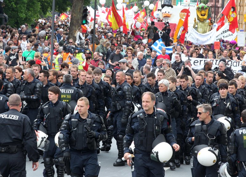 German police escort marchers Saturday in Frankfurt. Protesters filled the city center to protest the dominance of banks and what they perceive to be untamed capitalism.