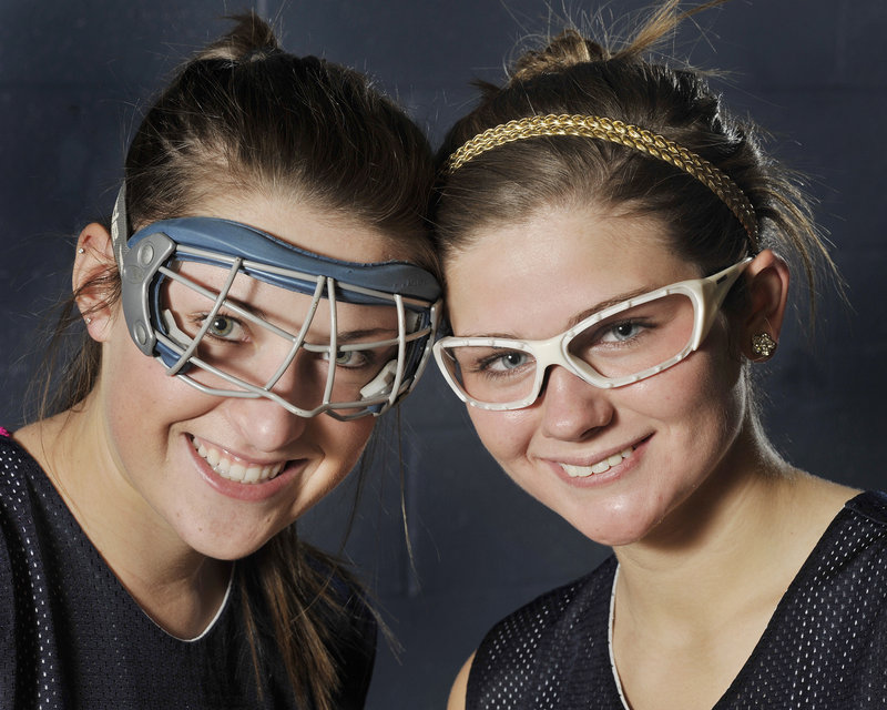Westbrook athletes Emily Blackmore, left, and Tori Winton wear the two types of required eye protection for field hockey players.