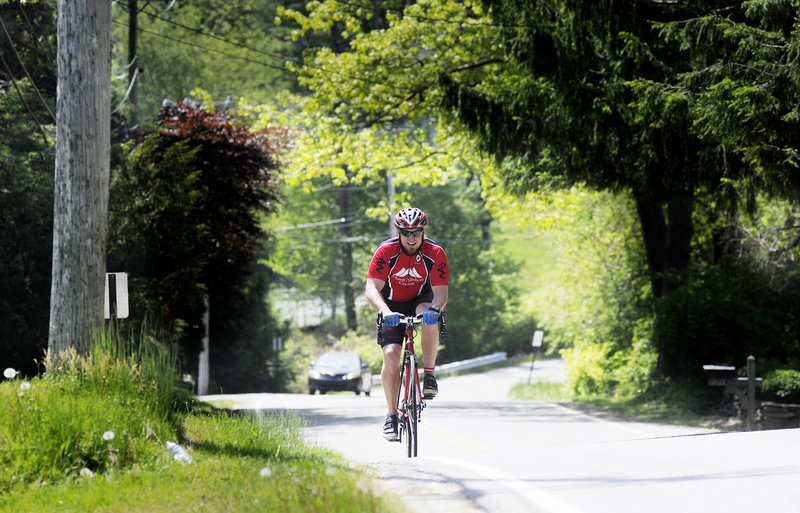 A cyclist travels Shore Road on Monday. Walkers, joggers and cyclists currently use a narrow shoulder along the road.