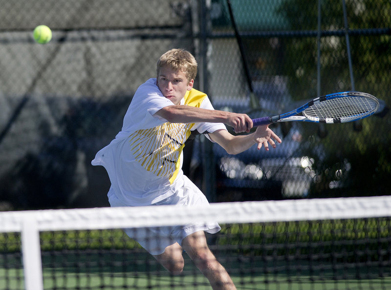 David Woodbury of Cheverus hits a forehand in his No. 1 singles match Monday against Ryan Johnson of Windham. Windham won 4-1 in the regular-season finale for both teams.