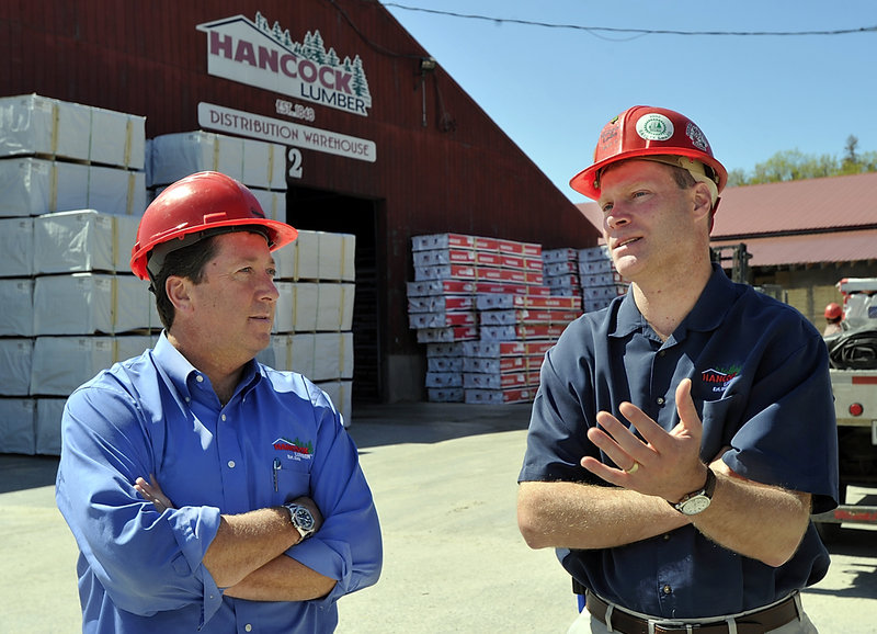 Kevin Hancock, president of Hancock Lumber in Casco, listens as Matt Duprey, vice president of sales, talks about his upcoming business trip to Japan to sell lumber.