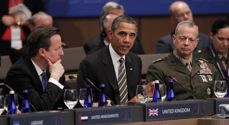 President Obama speaks Monday at a NATO summit in Chicago, as British Prime Minister David Cameron, left, and Gen. John Allen, commander of U.S. and NATO forces in Afghanistan, listen.