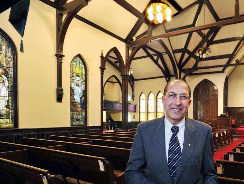 Frank Monsour stands in the sanctuary of the Williston-West church building he owns on Thomas Street.