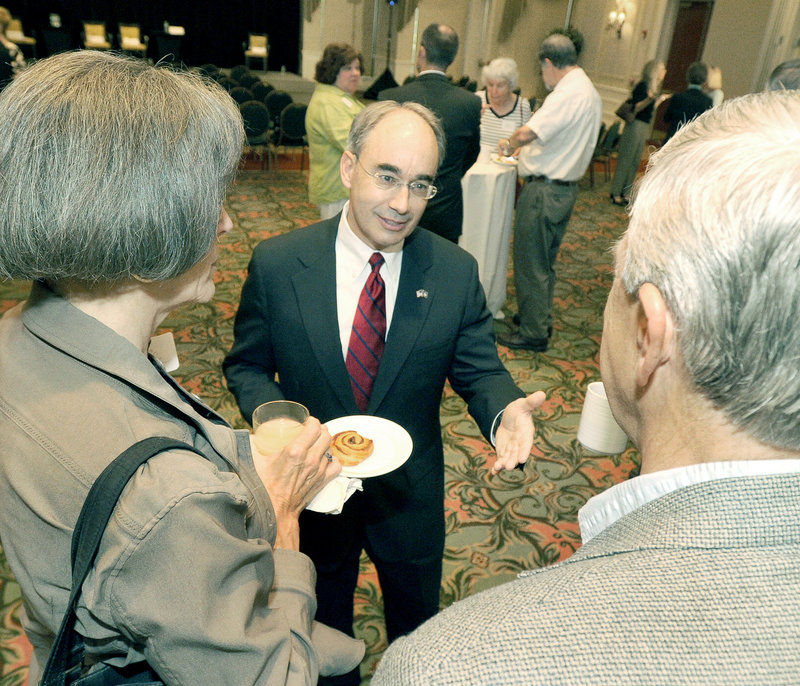 Bruce Poliquin, state treasurer and GOP candidate for U.S. Senate, greets members of the Portland Regional Chamber before an event at Sable Oaks Marriott in South Portland on Wednesday.