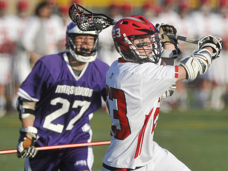Jon Blaisdell, who had four goals and two assists Wednesday night for Scarborough, sets up for a shot on goal after working his way past Brandon Lebel of Marshwood. Scarborough, the top-ranked team in Western Class A, won 11-4.