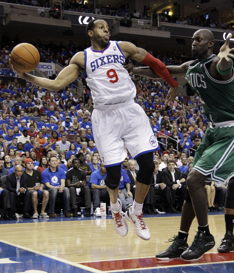 Andre Iguodala of the Philadelphia 76ers tries to pass while guarded by Kevin Garnett of the Celtics in the Sixers’ 82-75 victory Wednesday in Game 6.