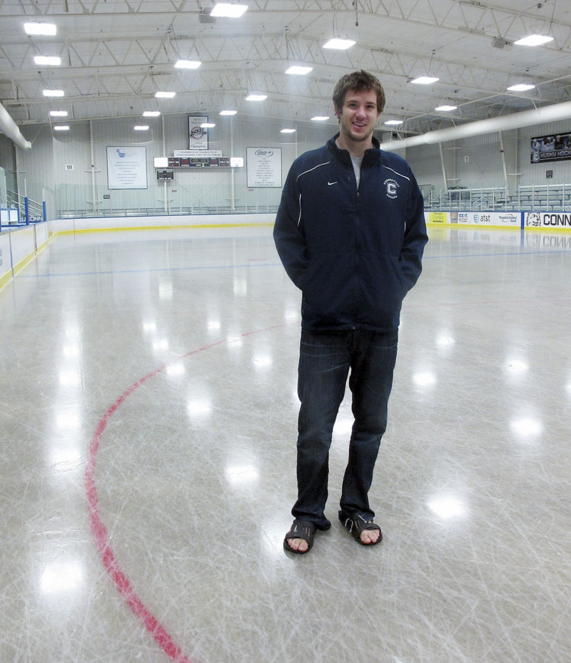 University of Connecticut hockey goalie Garrett Bartus poses on the rink at the Mark Edward Freitas Ice Forum on campus in Storrs, Conn. Bartus and his teammates have produced a video for the You Can Play project, pledging to accept any gay or transgender hockey player on their team.