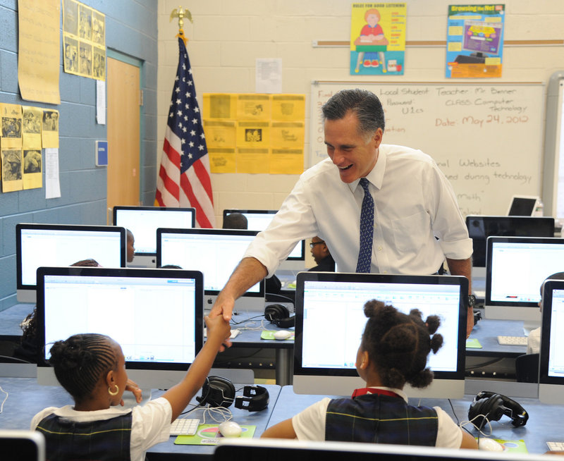 Republican presidential hopeful Mitt Romney greets students in a computer class at Universal Bluford Charter School in West Philadelphia, Pa., on Thursday.