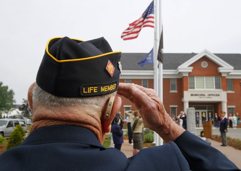 Korean War veteran Gilbert Ormsby of American Legion Post 202 in Topsham salutes as the American flag is raised at Topsham Town Hall on May 31, 2010, before the start of the Memorial Day parade. A reader praises World War II and Korean War veterans for their service and says, “Our last opportunities to recognize and thank them are upon us.”