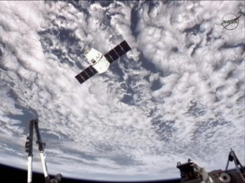 An image provided by NASA-TV shows the SpaceX Dragon commercial cargo craft as Dragon approaches the International Space Station on Friday. Dragon is scheduled to spend about a week docked with the station before returning to Earth on Thursday for retrieval.