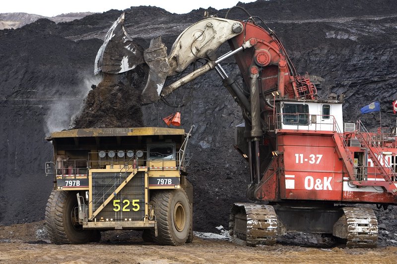 A massive crane loads a high-capacity dump truck at one of Syncrude Canada’s Oil Sands mining operations near Fort McMurray, Alberta. Operations like Syncrude’s are transforming the Western Hemisphere’s role in oil production.