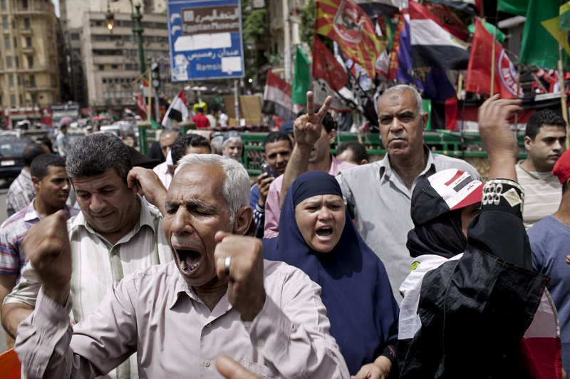 Egyptian demonstrators denounce the electoral success of Ahmed Shafiq, a former prime minister, in Cairo on Friday. Shafiq faces a runoff vote against an Islamist candidate.