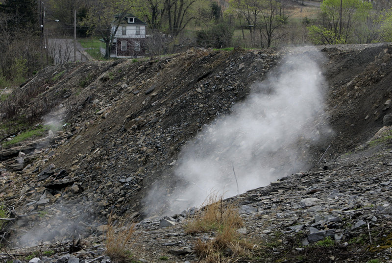 Steam from burning underground coal rises from the ground in Centralia, Pa., 50 years after a fire at the town dump spread to an underground network of coal mines. Eventually, the town was evacuated and demolished, except for a few holdouts.