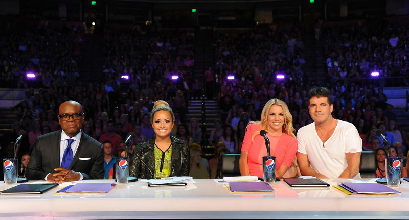 “The X Factor” judges are, from left, L.A. Reid, Demi Lovato, Britney Spears and Simon Cowell, shown Thursday on the singing-contest show in Austin, Texas.