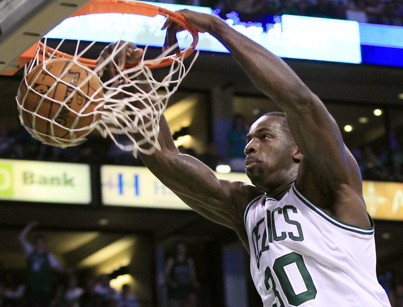 Brandon Bass of the Boston Celtics gets a close look at the basket Saturday, dunking the ball against the Philadelphia 76ers in Game 7 of their playoff series. The Celtics won, 85-75.