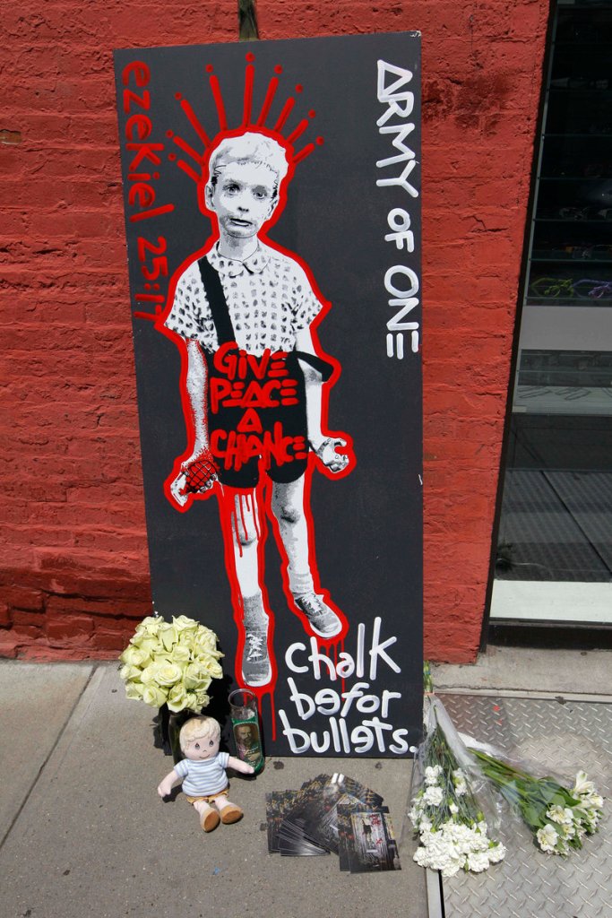 Artwork and other items form a makeshift memorial Sunday at the site in New York where a suspect claims to have strangled Etan Patz, who was 6 when he disappeared in 1979.