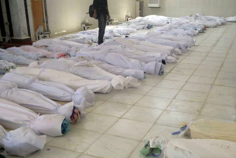 A photo taken by a citizen journalist on Saturday purports to show shrouded dead bodies following an assault on Houla, Syria.