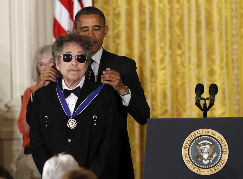 President Obama presents rock legend Bob Dylan with a Medal of Freedom during a ceremony Tuesday at the White House in Washington.