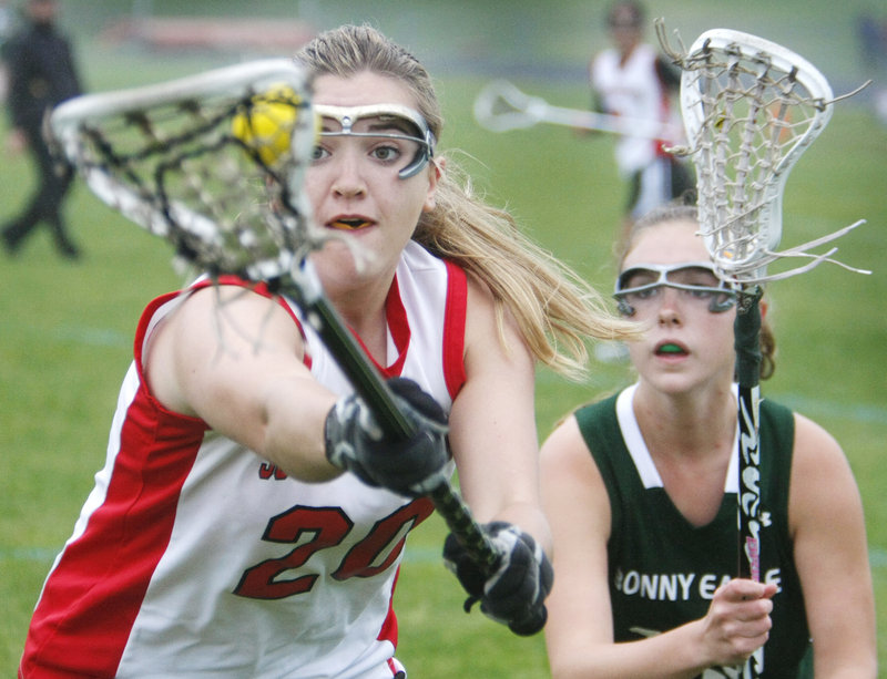 Olivia Edwards of South Portland keeps possession while pressured by Jordan Ray of Bonny Eagle during South Portland’s 10-7 victory Tuesday.