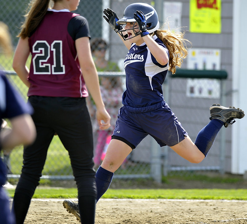 Maddy Smith of Fryeburg Academy crosses the plate in the second inning Wednesday, after hitting a two-run triple, then scoring when the relay throw hit her and bounced into left field. That was enough for the Raiders to beat Greely, 3-1.