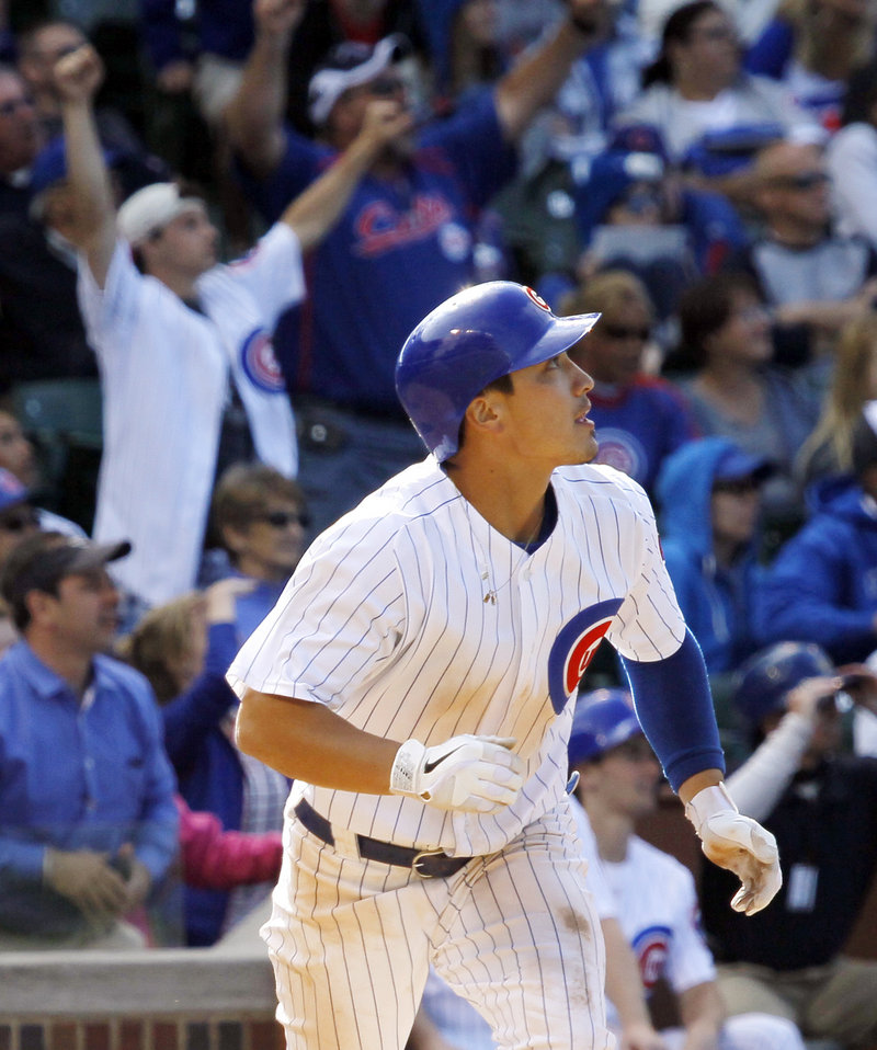 Darwin Barney watches his two-run homer in the bottom of the ninth inning on Wednesday that gave the Cubs an 8-6 win over the San Diego Padres in Chicago.