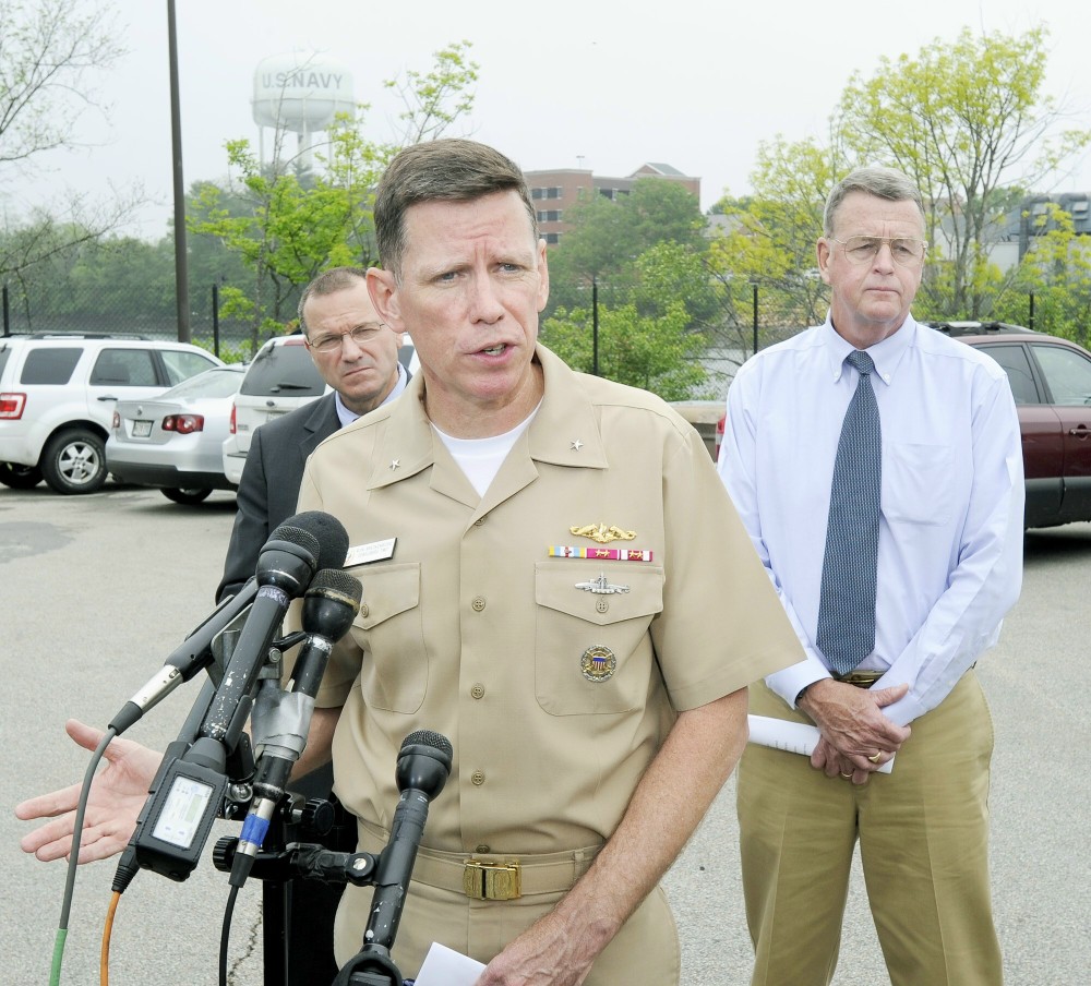 John Patriquin/Staff Photographer.Thurs., May,24,2012. Rear admiral Rick Breckenridge is joined by NH director of homeland security & emergency management Chris Pope (left) and director of Maine emergency management administration Rob McAleer at a Press conference at the gate of the Portsmouth Naval Shipyard.