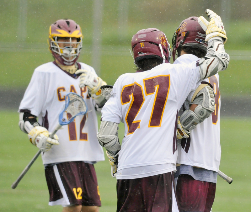 Justin Cary, 27, who scored five goals, celebrates with Tim Lavallee, left, and Brian Brett after a first-half Cape goal.