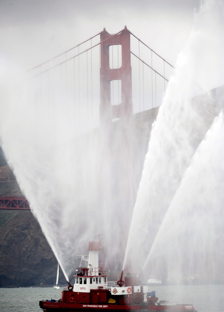 The Phoenix fireboat sprays plumes of water as part of the Golden Gate Bridge's 75th anniversary celebration Sunday in San Francisco.